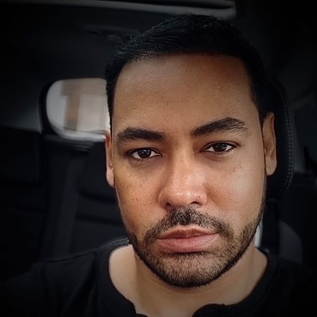 César Vargas seated in a car.